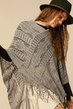 Lightweight crochet knit poncho in grey with tassel accent
