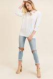 Ivory top with criss-cross neckline in sizes S-L