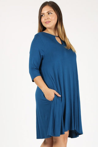 Plus size teal dress with cut-out detail