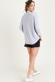 Grey blue top with mock neck and cross-cross detail in sizes S-L