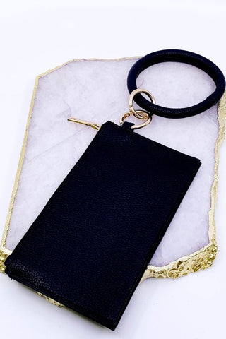Black keychain bracelet with small wallet.